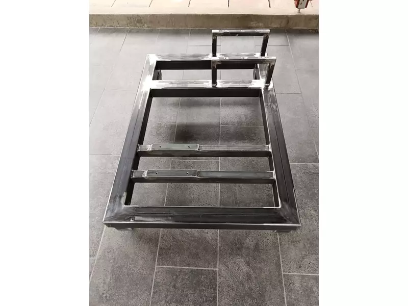 Overall view of welded steel base frame with integrated support structure and mounting crossmembers..webp